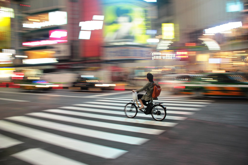 a person riding a bicycle in the city