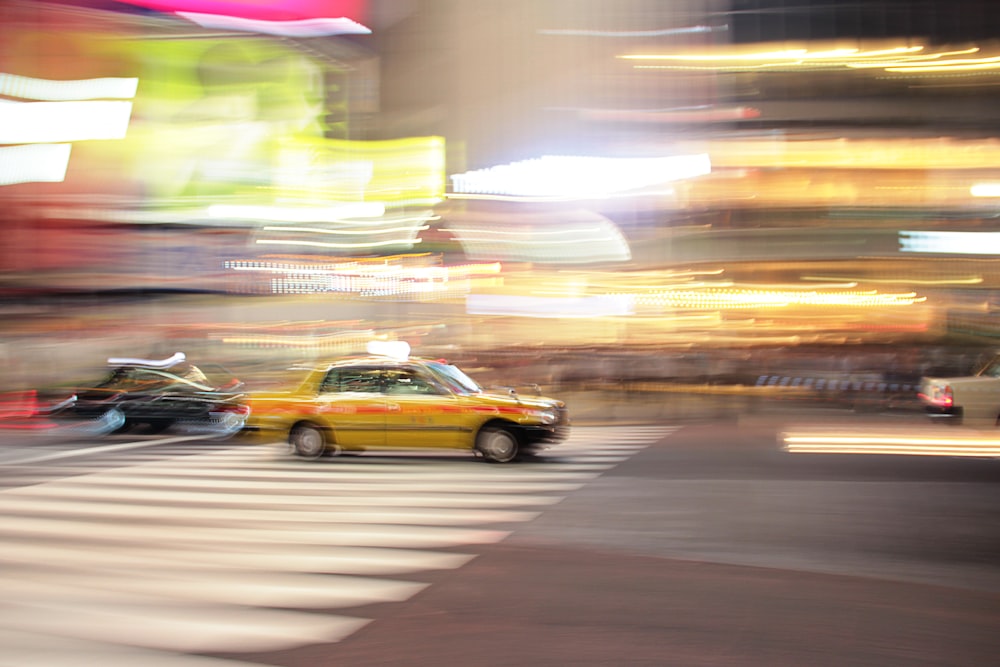 a group of cars driving on a road