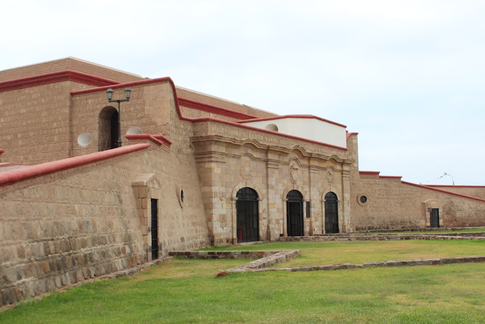 a brick building with a red roof