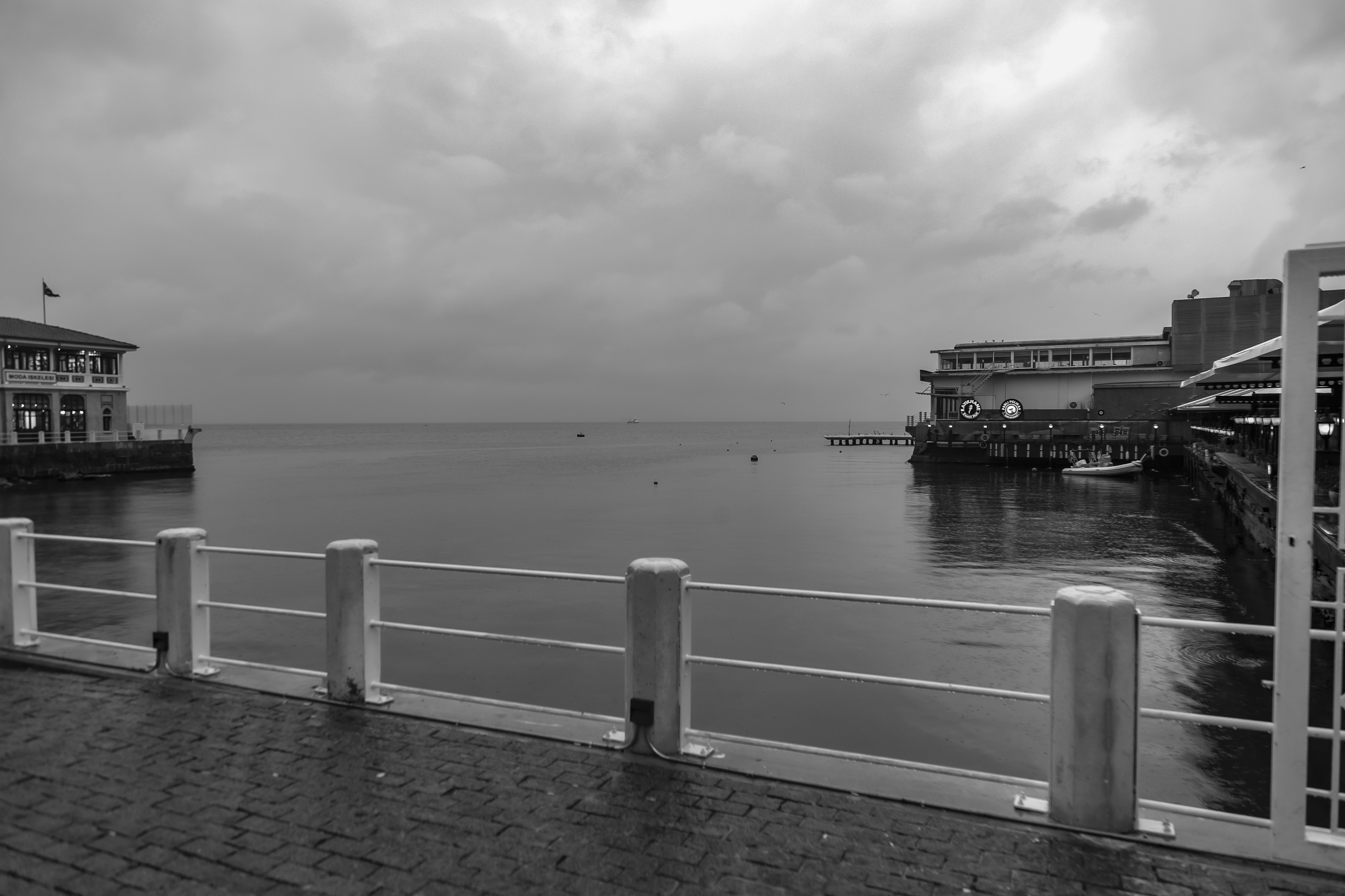 a body of water with buildings along it, 