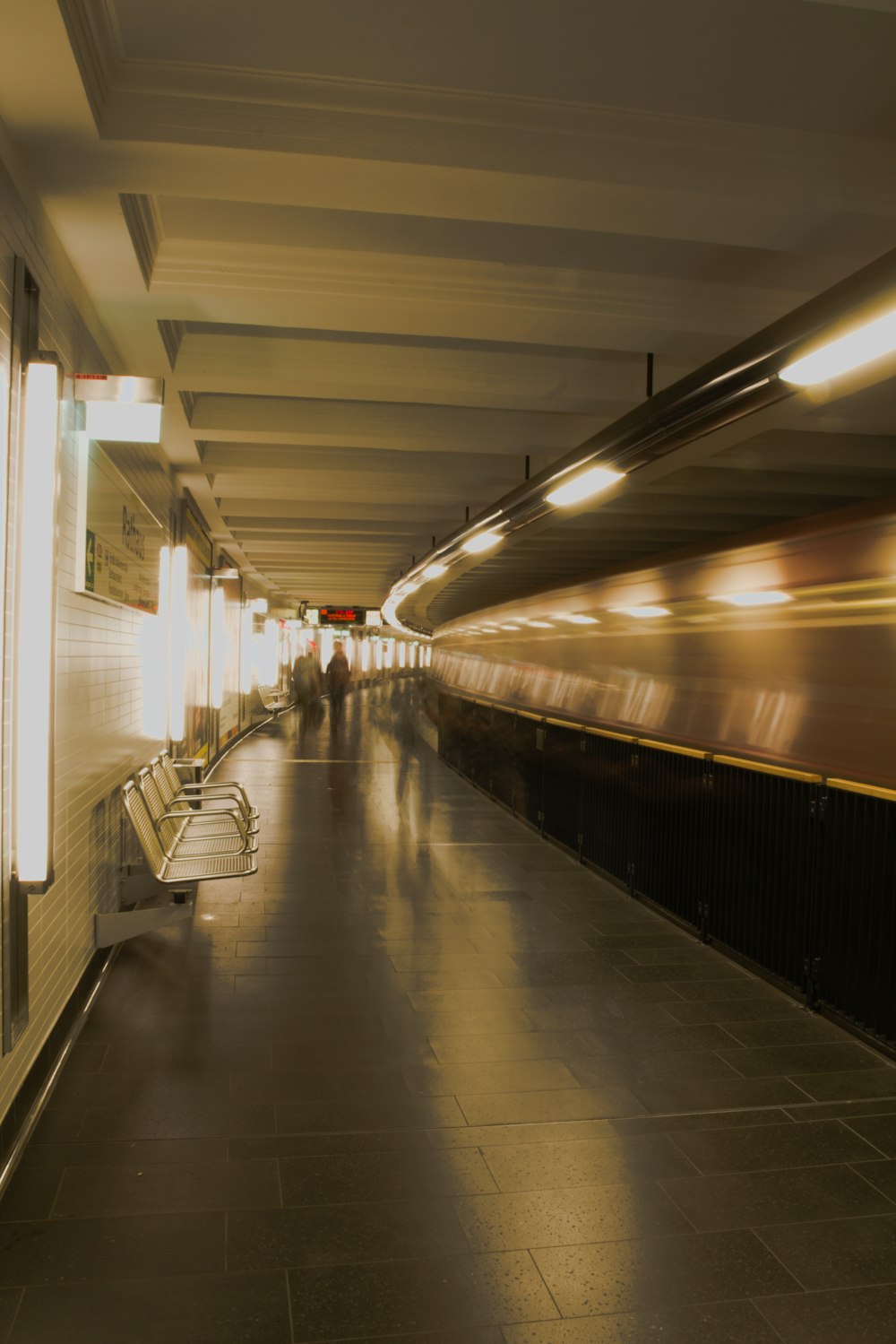 a train station with people