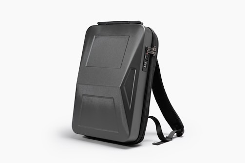 A stylish and sturdy travel backpack featuring multiple compartments and safety features.