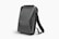 A sleek, black, hard-shell backpack with an ergonomic design. The front panel features distinct geometric patterns and a combination lock. The backpack has adjustable shoulder straps and a streamlined appearance, suitable for modern, urban settings.