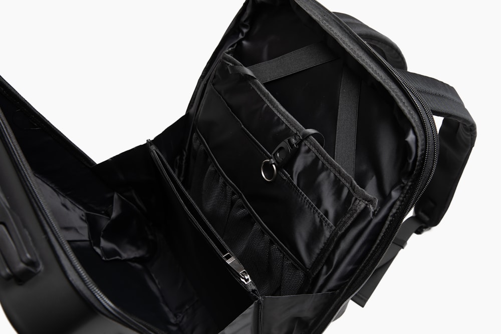 a black backpack with a strap