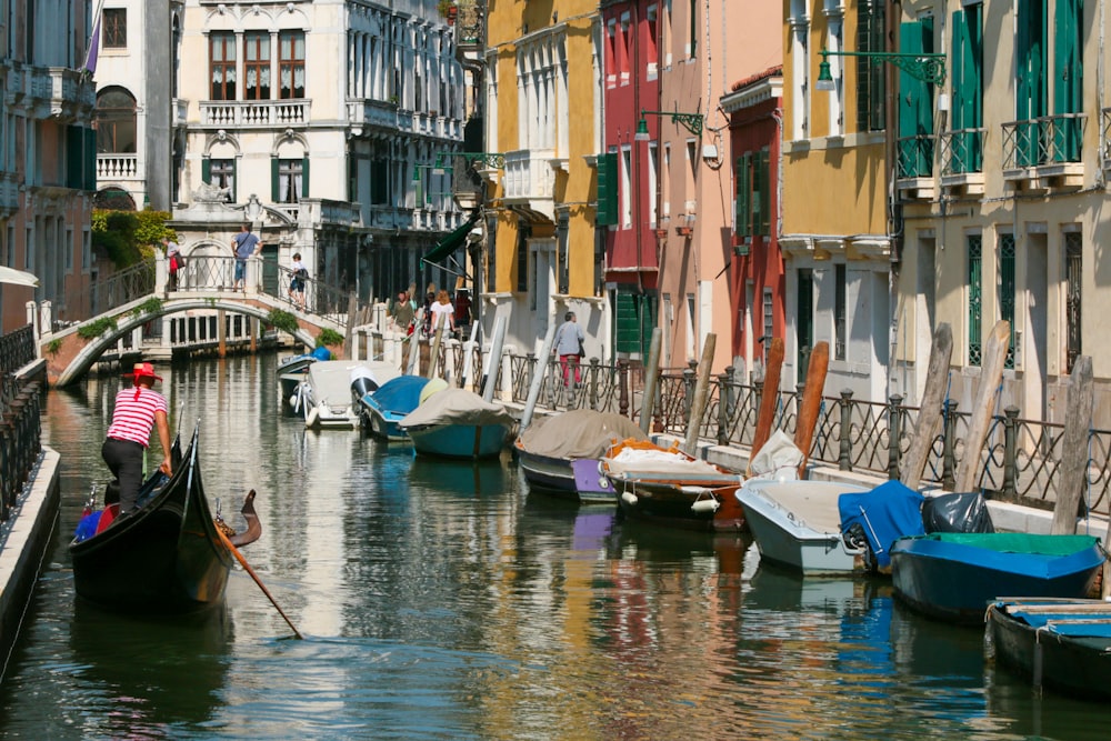 a person in a boat in a canal