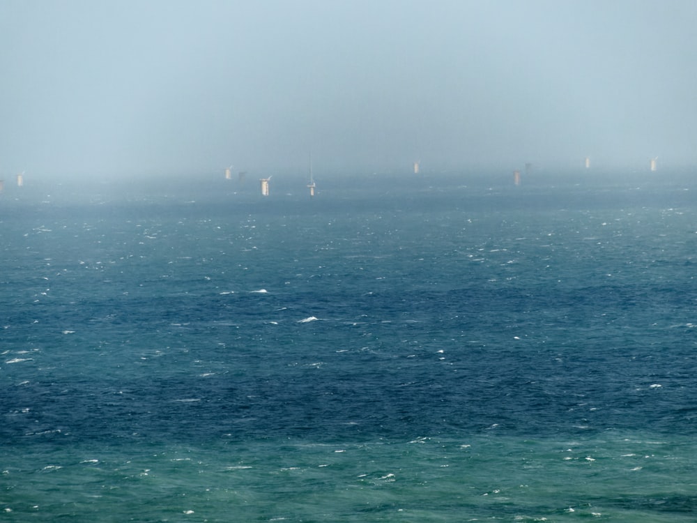 a body of water with a city in the distance