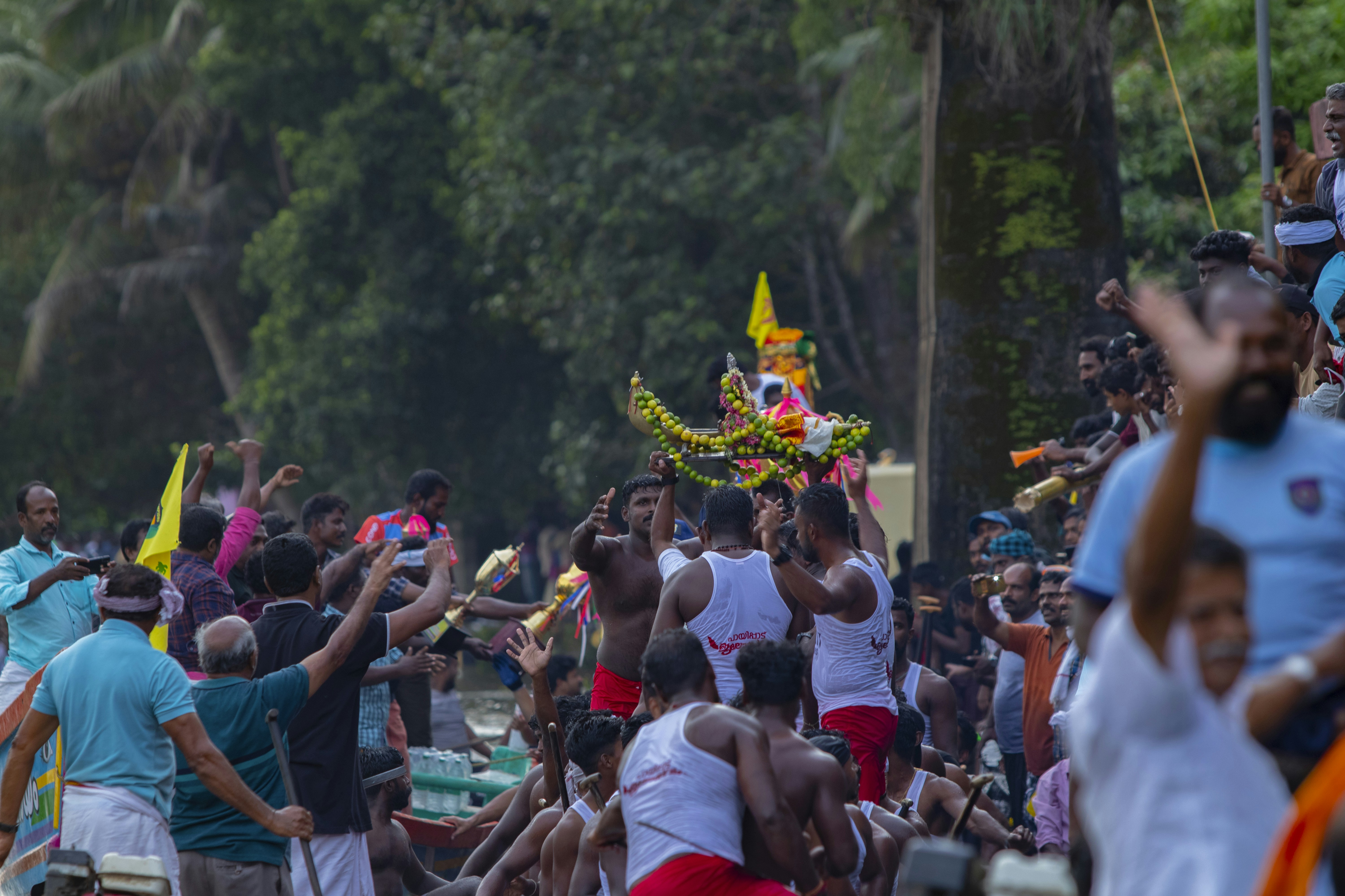 A person using a digital payment app on a smartphone, with secure transaction icons floating around, illustrating KYC's role in digital finance.