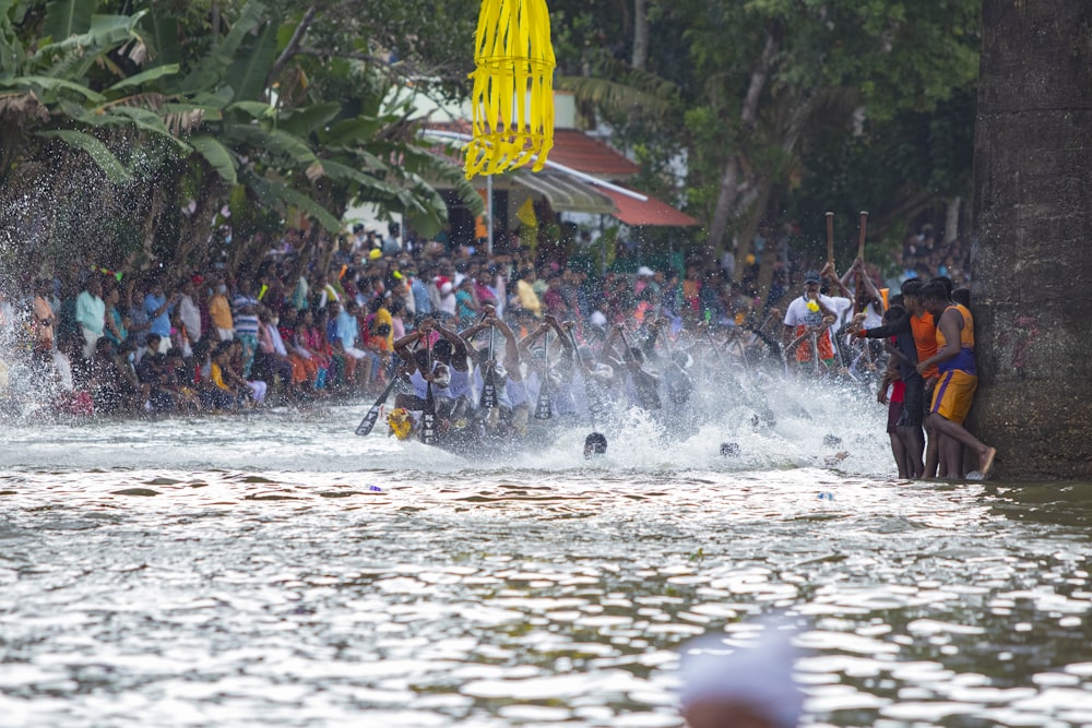 a group of people in a river