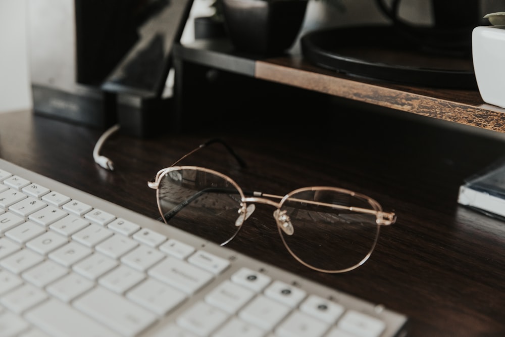 a keyboard with glasses on it