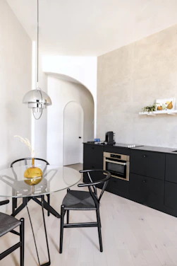 Modern minimalist kitchen set with clean lines and wooden accents in a cozy Depok home.