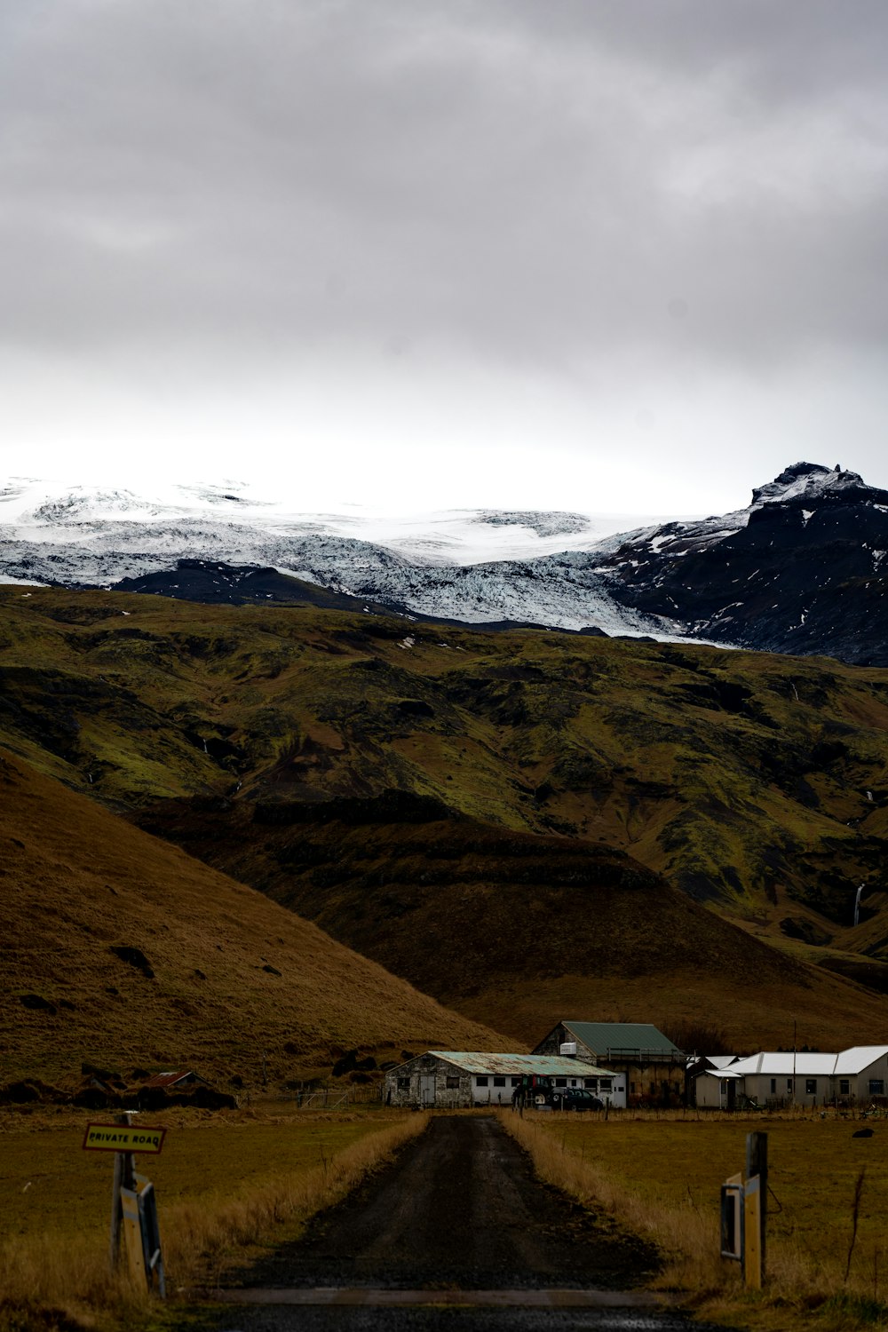 a road leading to a snowy mountain