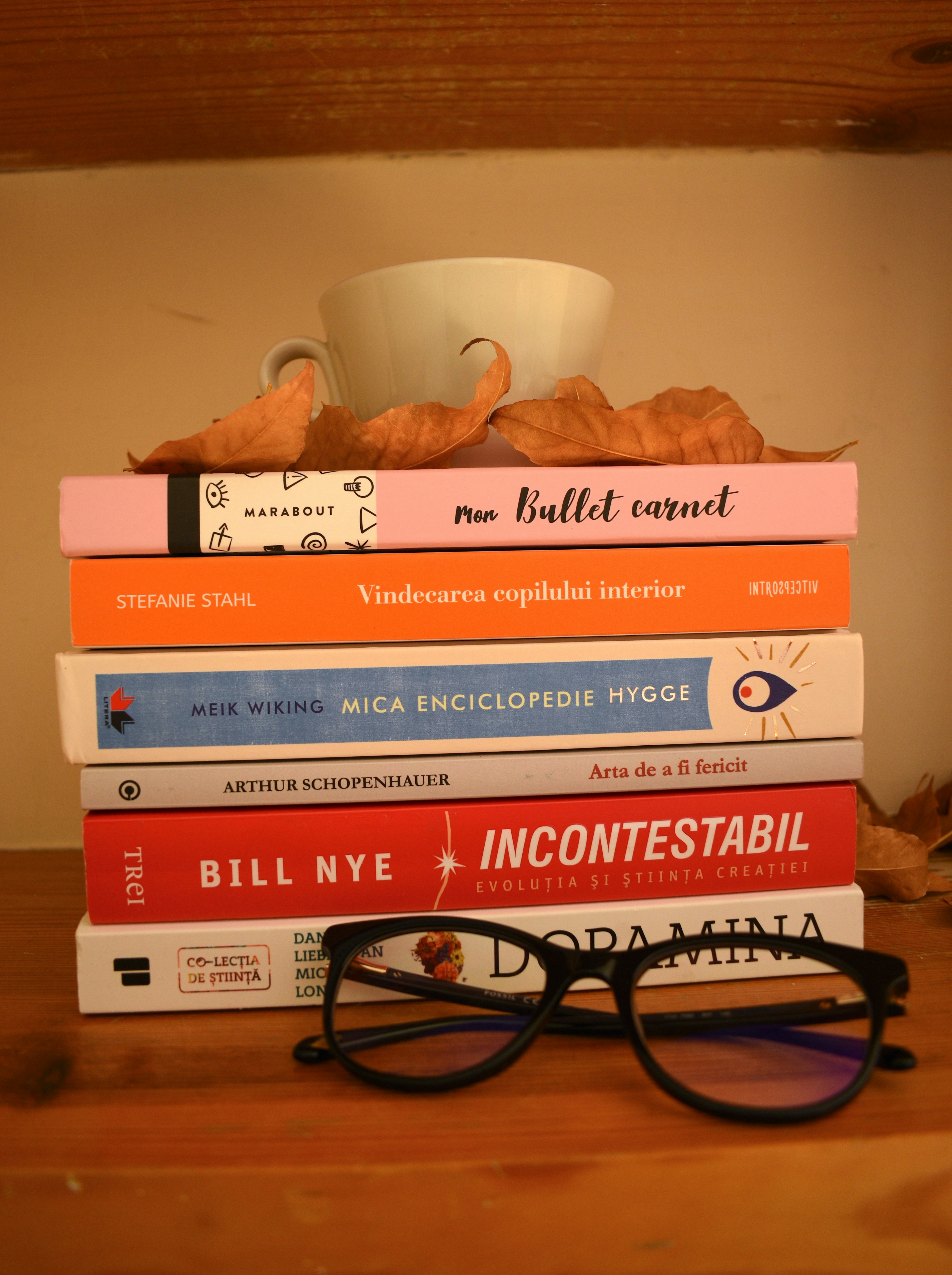 a stack of books with a bowl on top of it