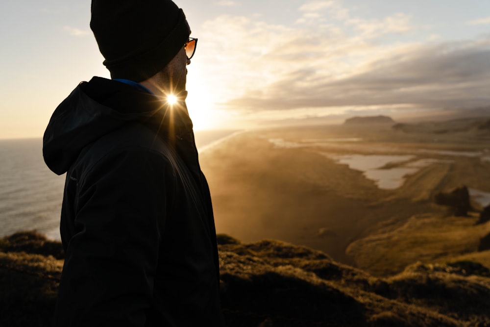 a person looking at the sunset