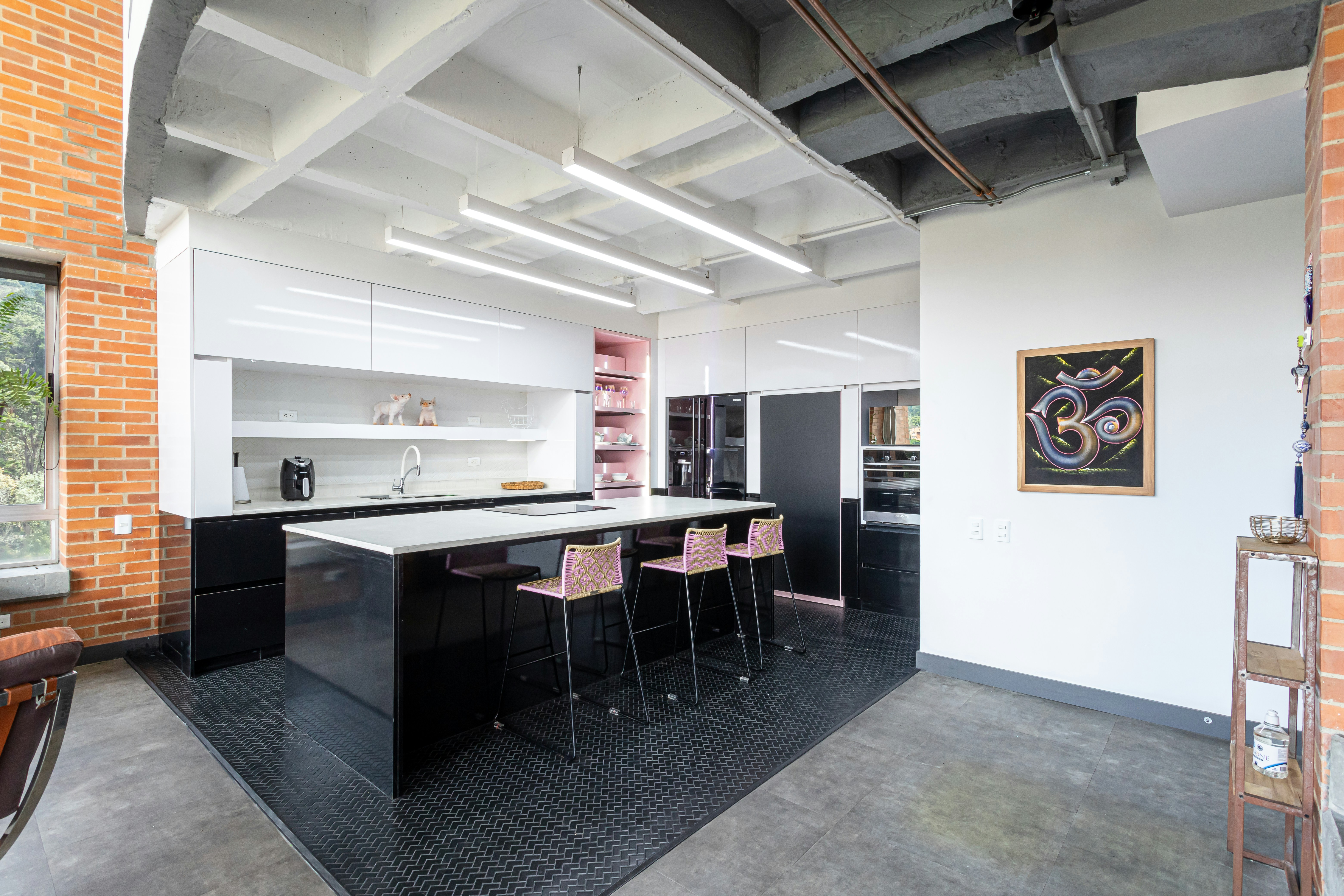 Modern coliving space with shared kitchen and work areas - apartments for remote workers