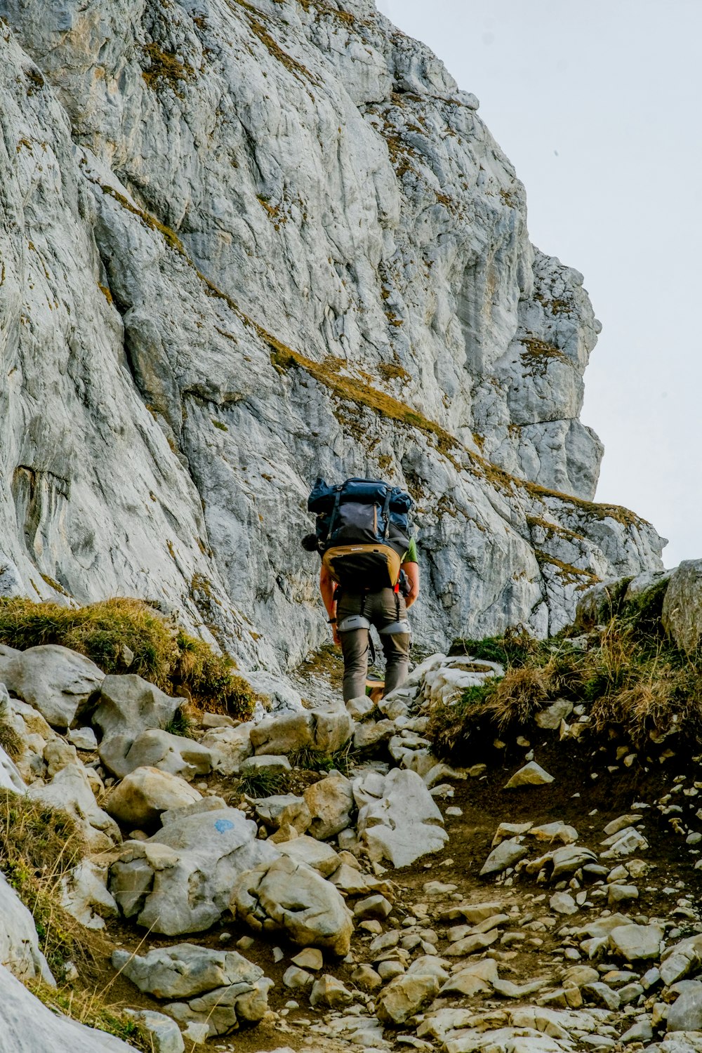 a person climbing a rocky mountain
