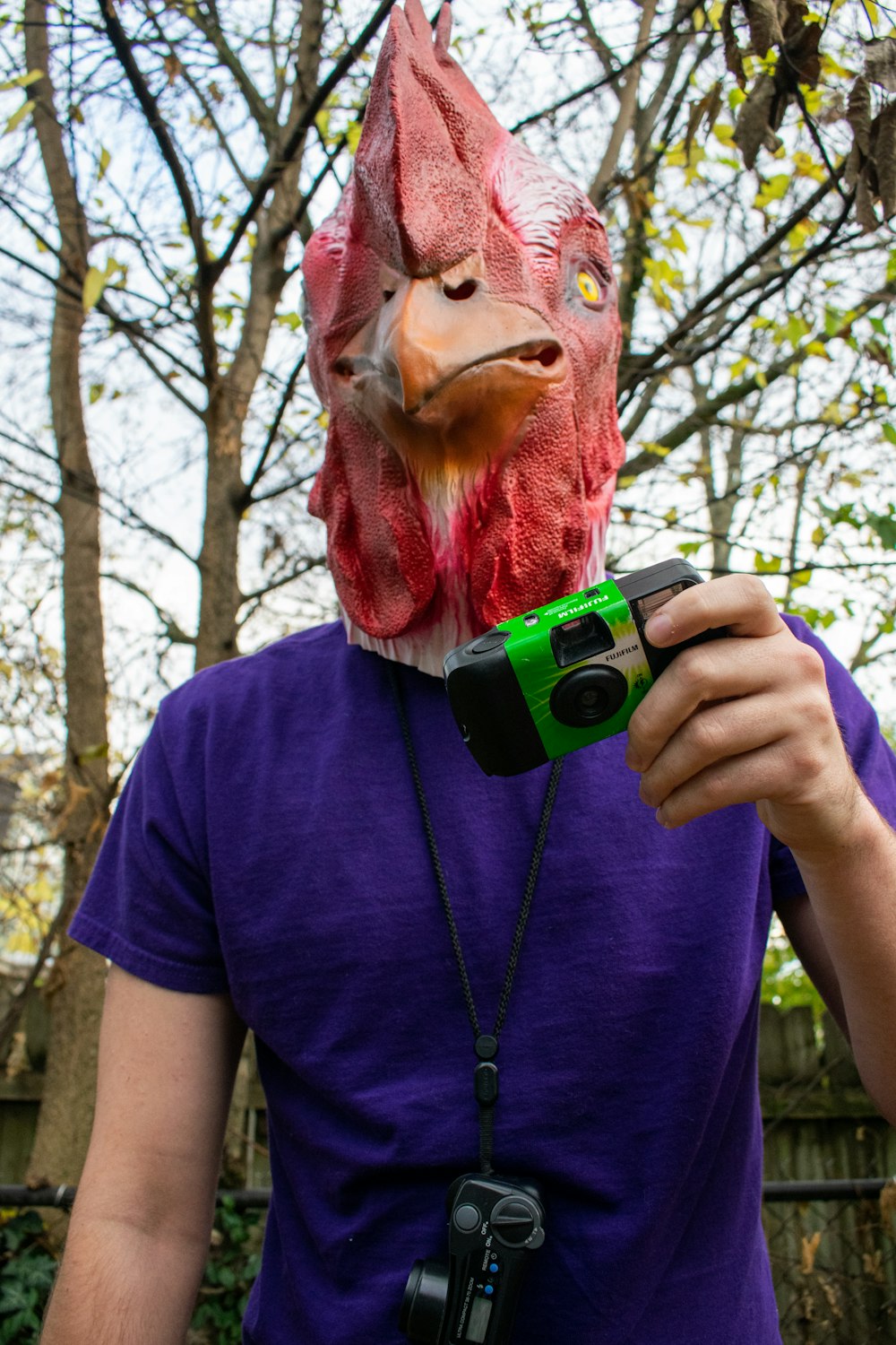 a man wearing a garment and holding a camera