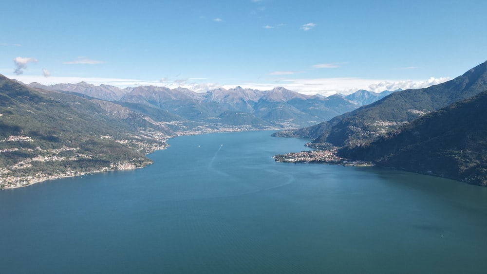 a body of water with mountains in the background