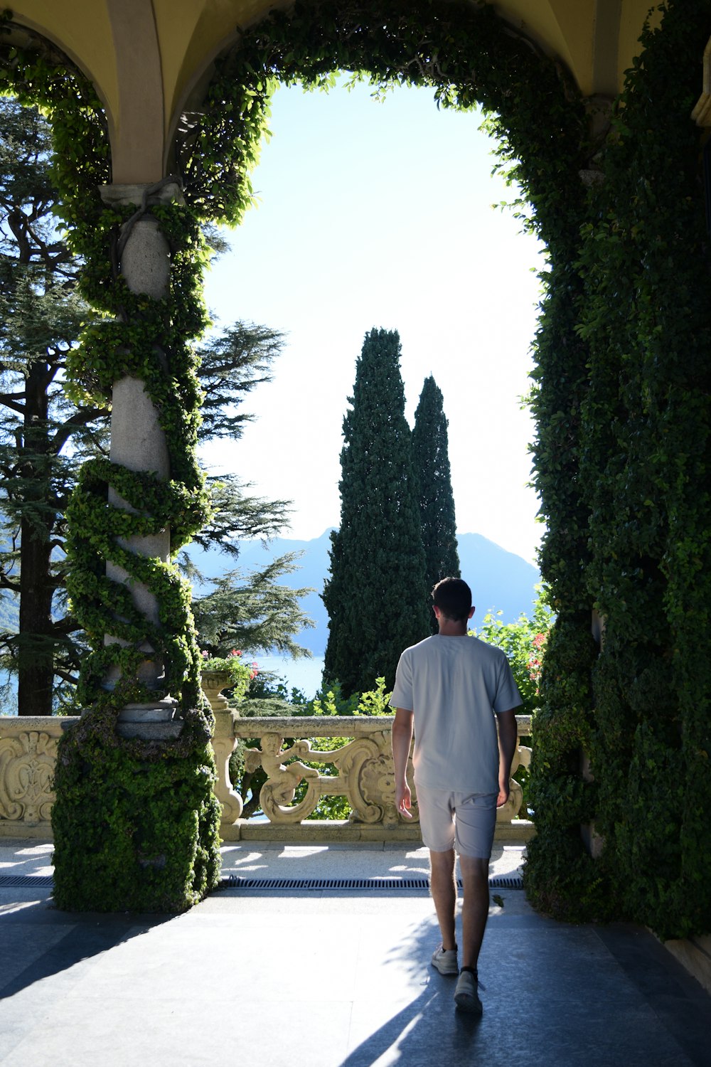 a man walking through a gate