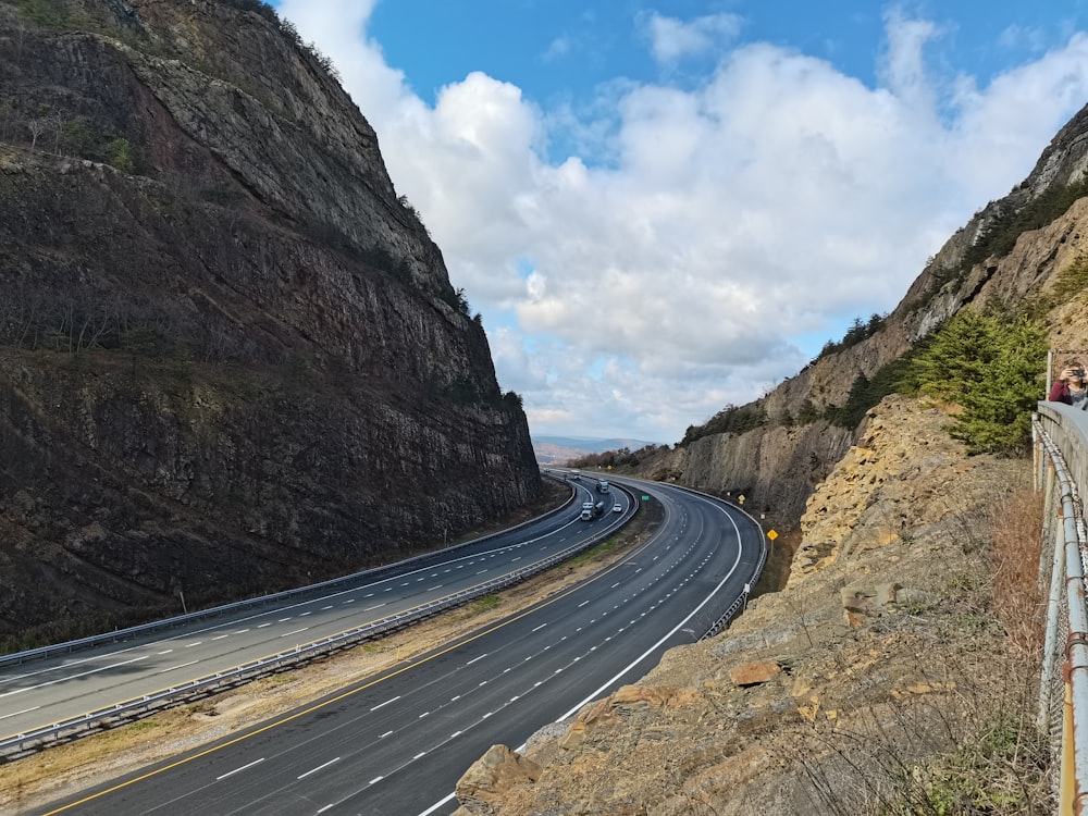 a road with a mountain in the background