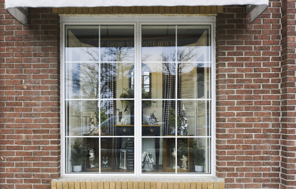 a window with a bunch of flowers in it