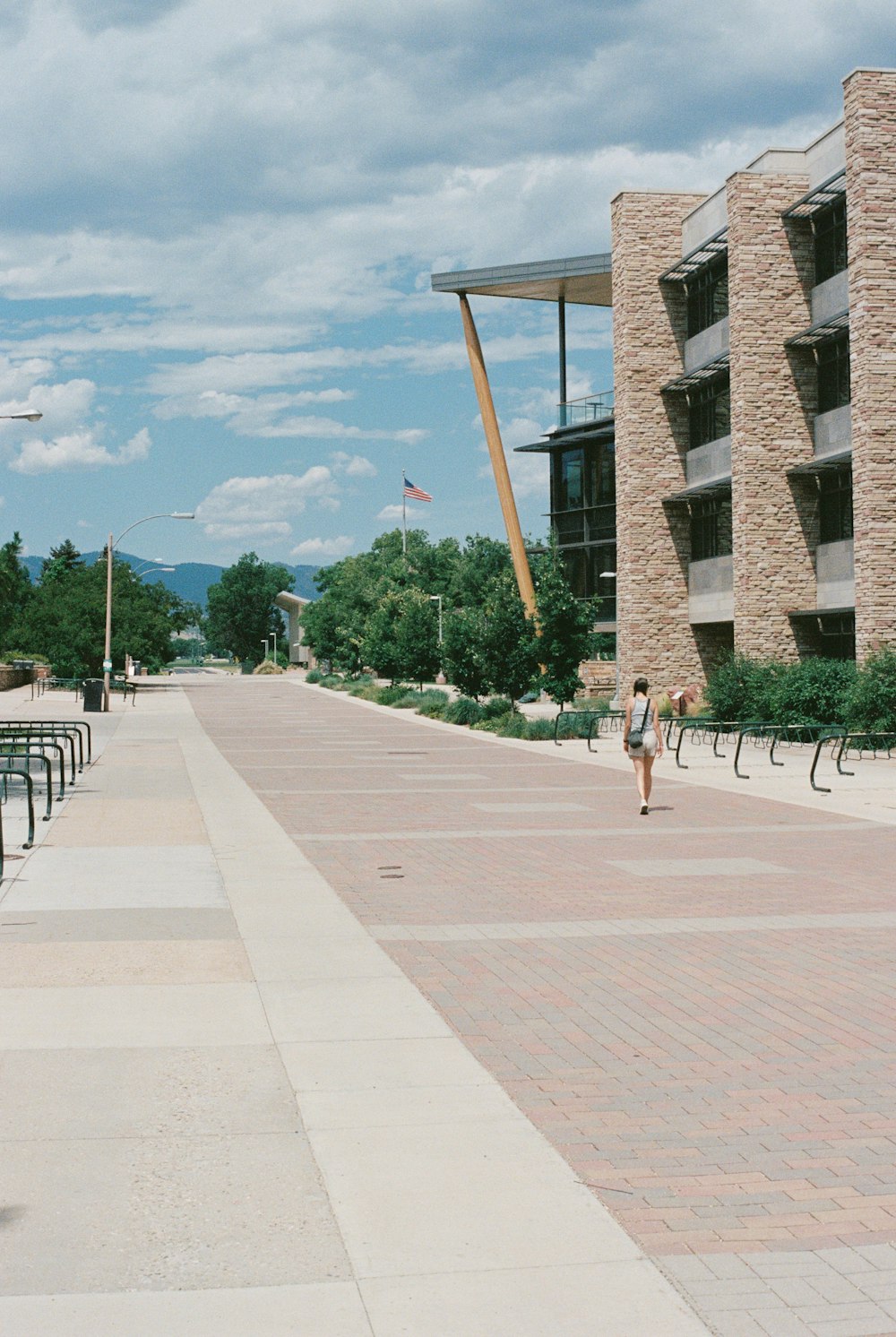 a person walking on a sidewalk