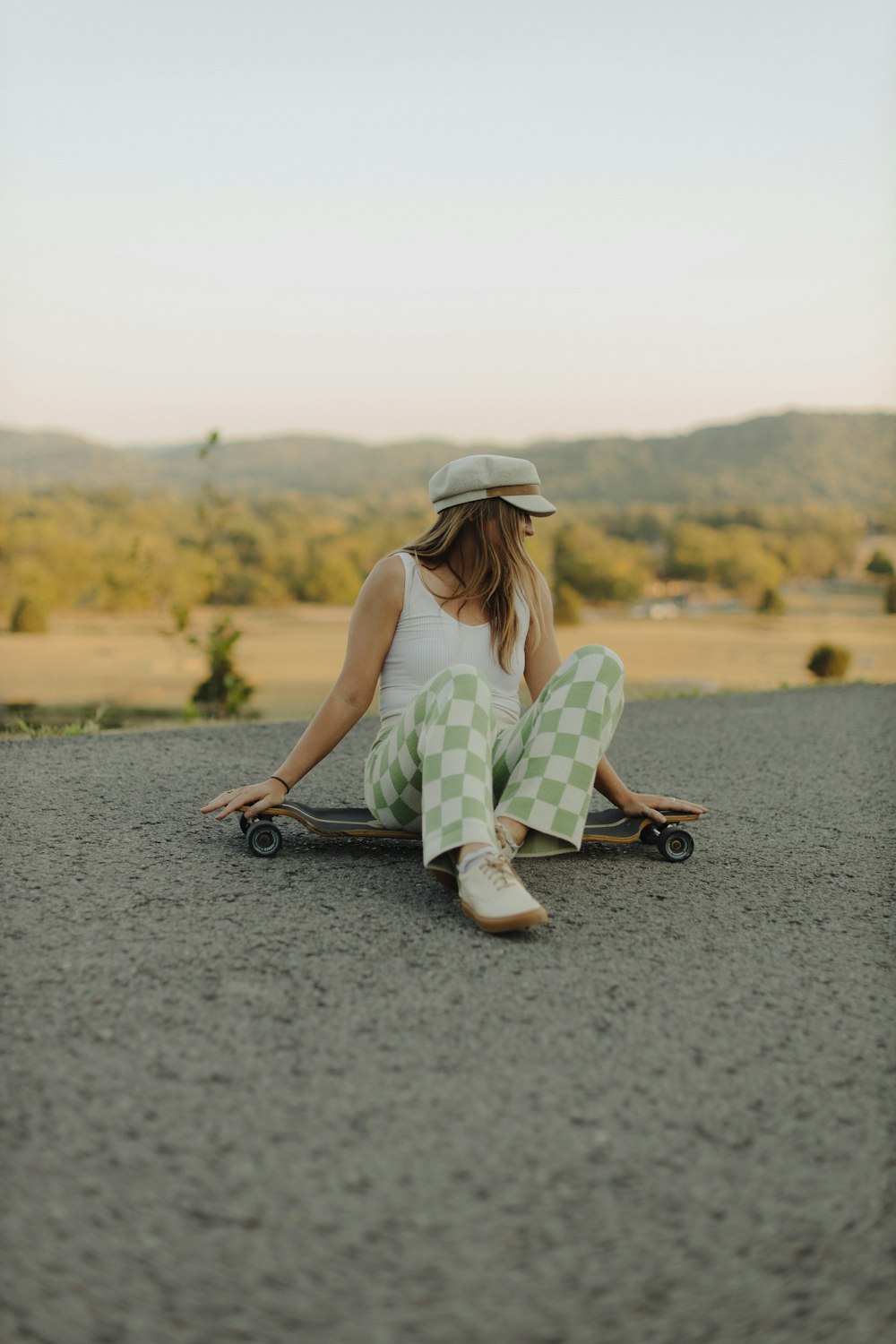 a person sitting on a skateboard