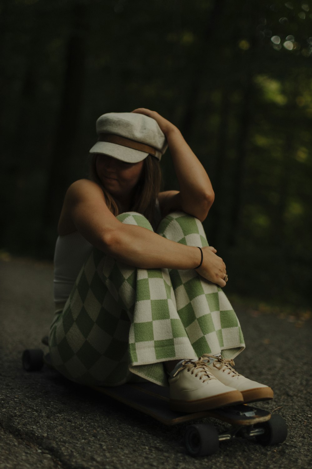 a person sitting on a skateboard