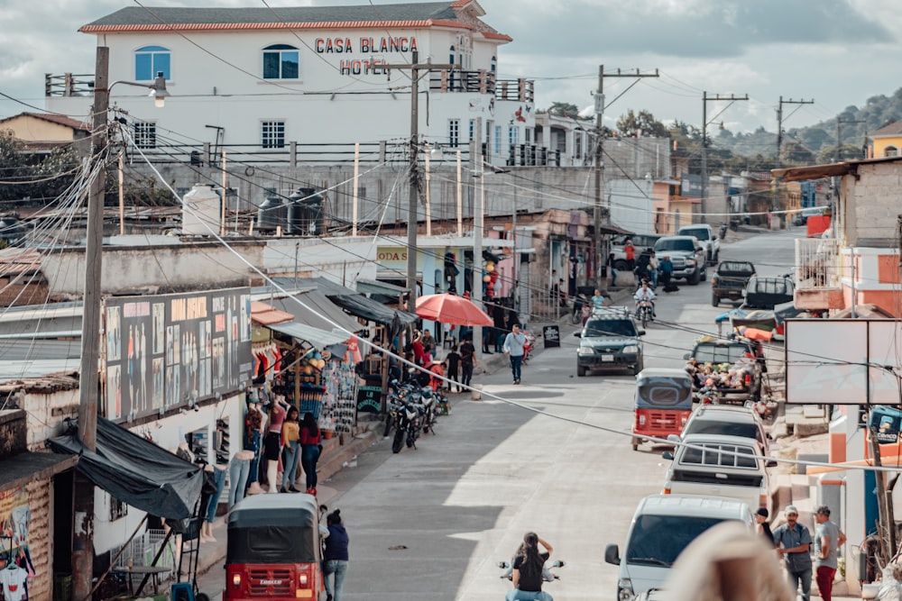 a busy street with cars and people