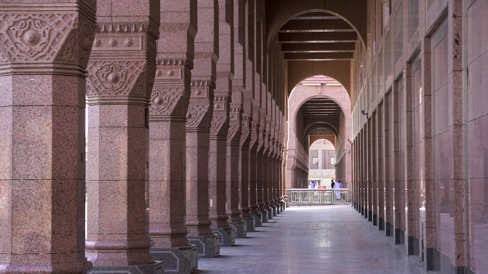 a walkway with pillars