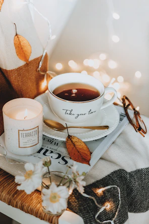 A cozy corner with a journal and a cup of tea, symbolizing a caregiver's quiet moment.