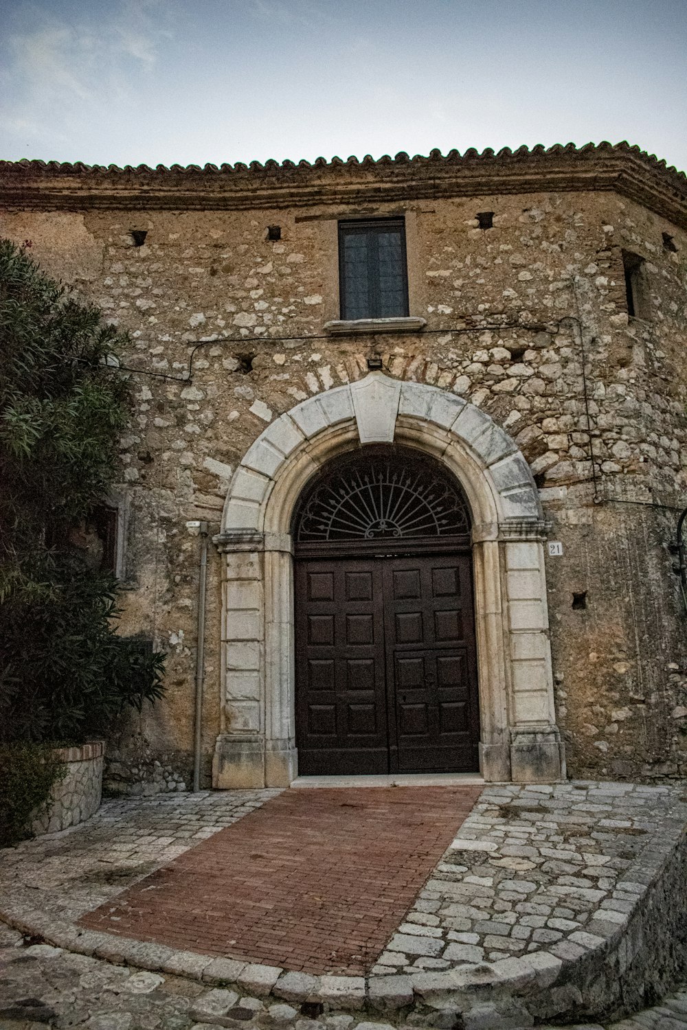 a stone building with a large door