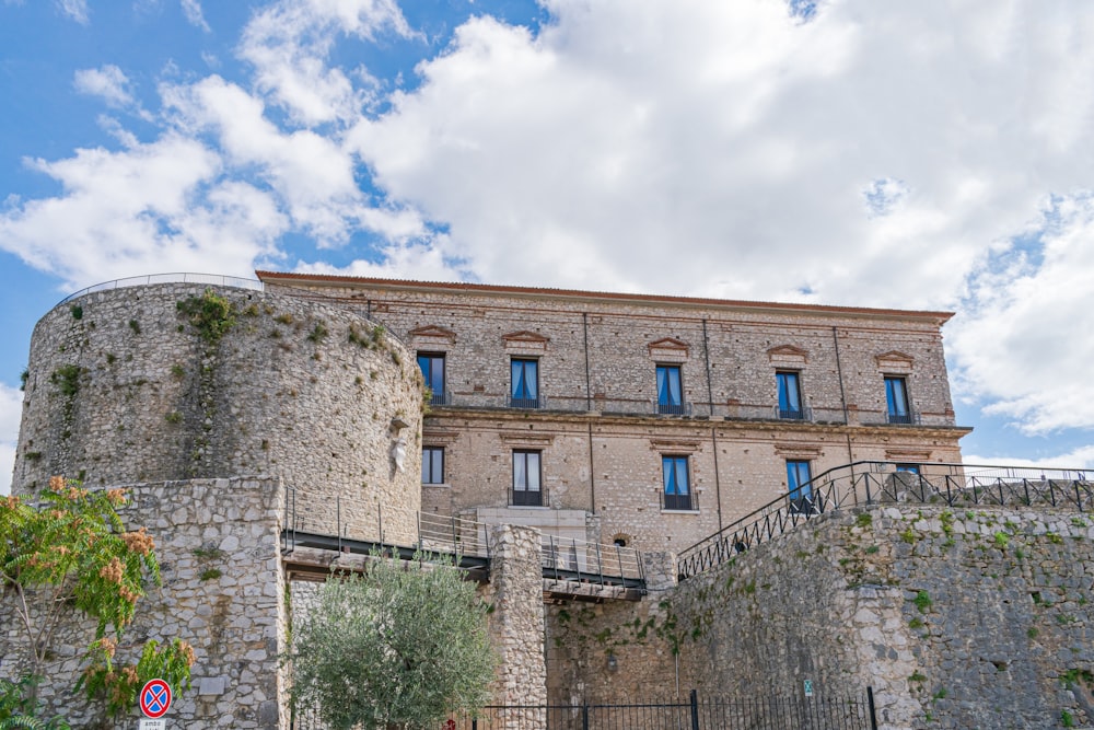 a stone building with a stone wall