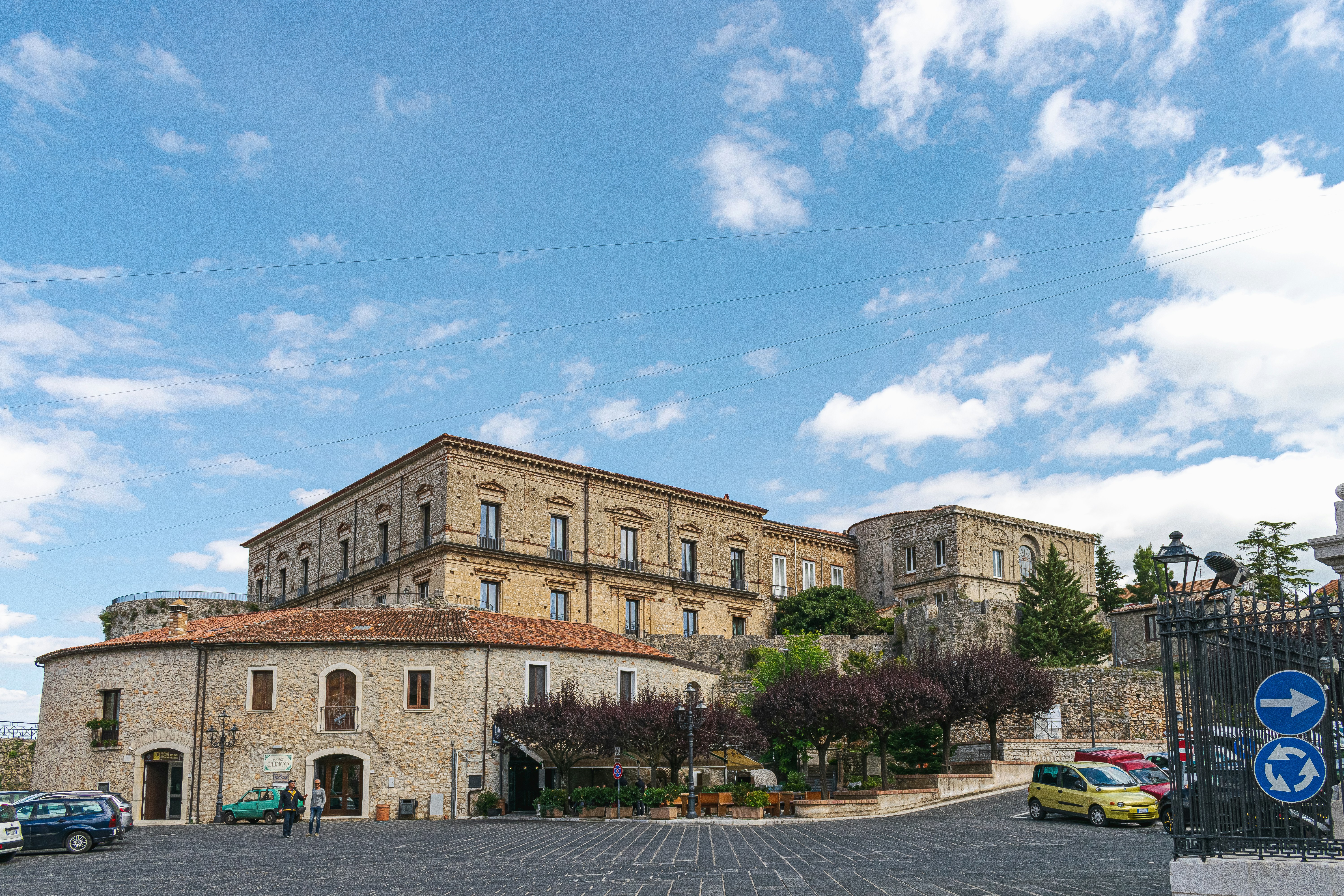 a large building with a fence around it