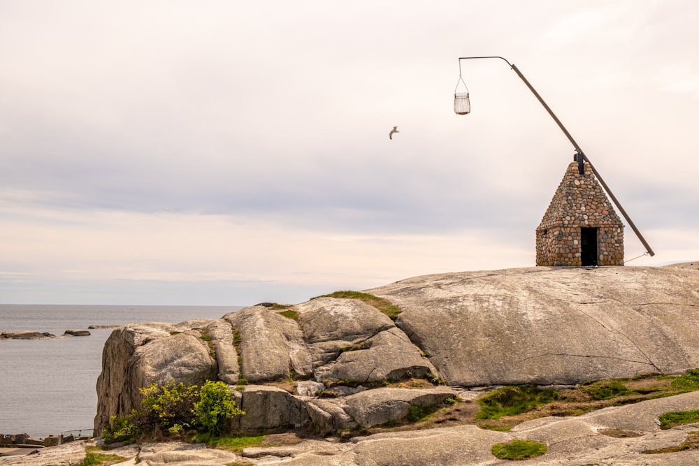 a stone building on a rocky hill