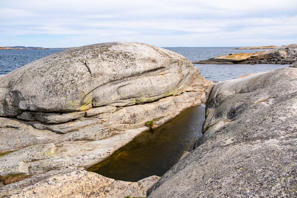 a large rock on a beach