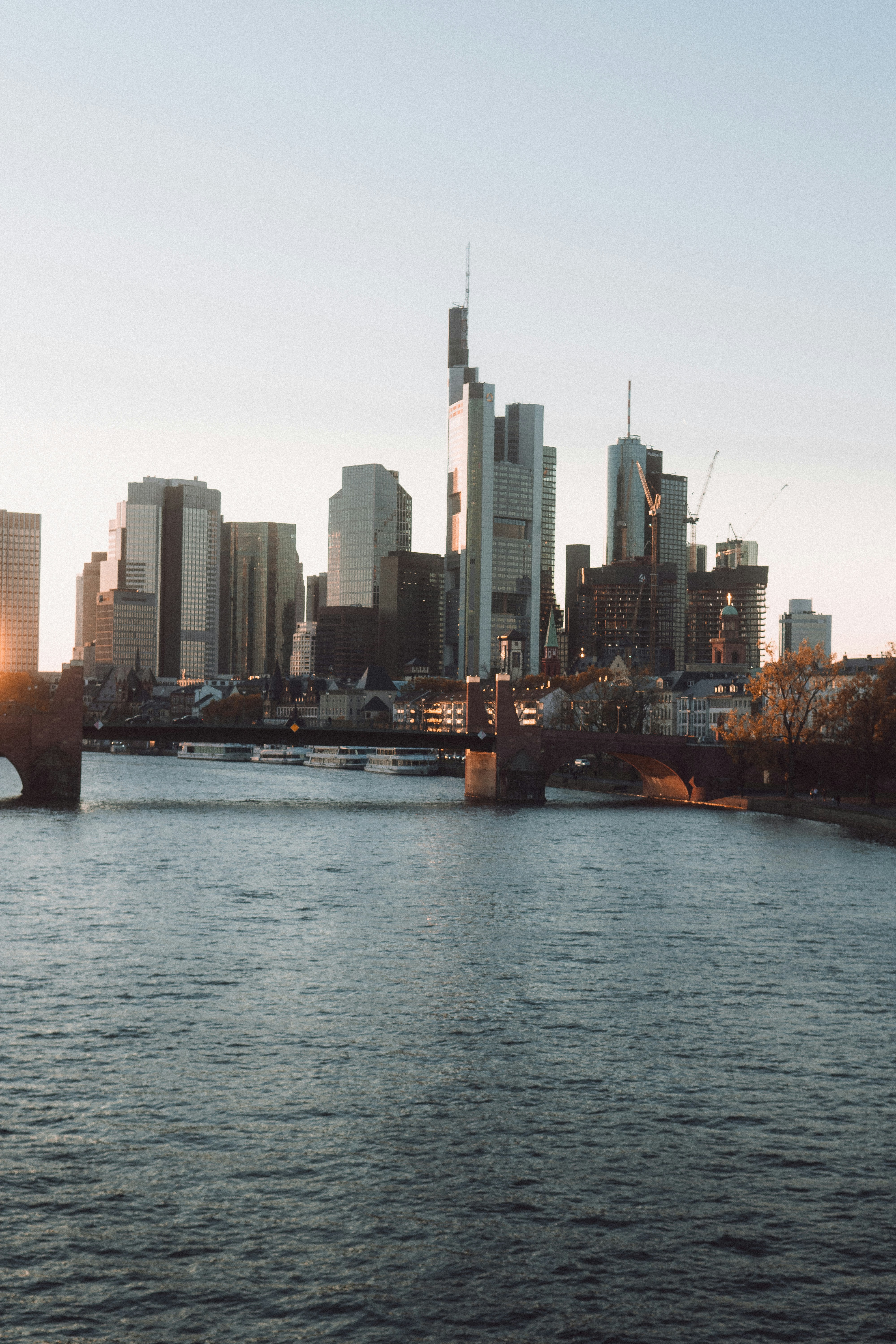 a city skyline with a river