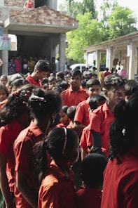 a group of people in red robes
