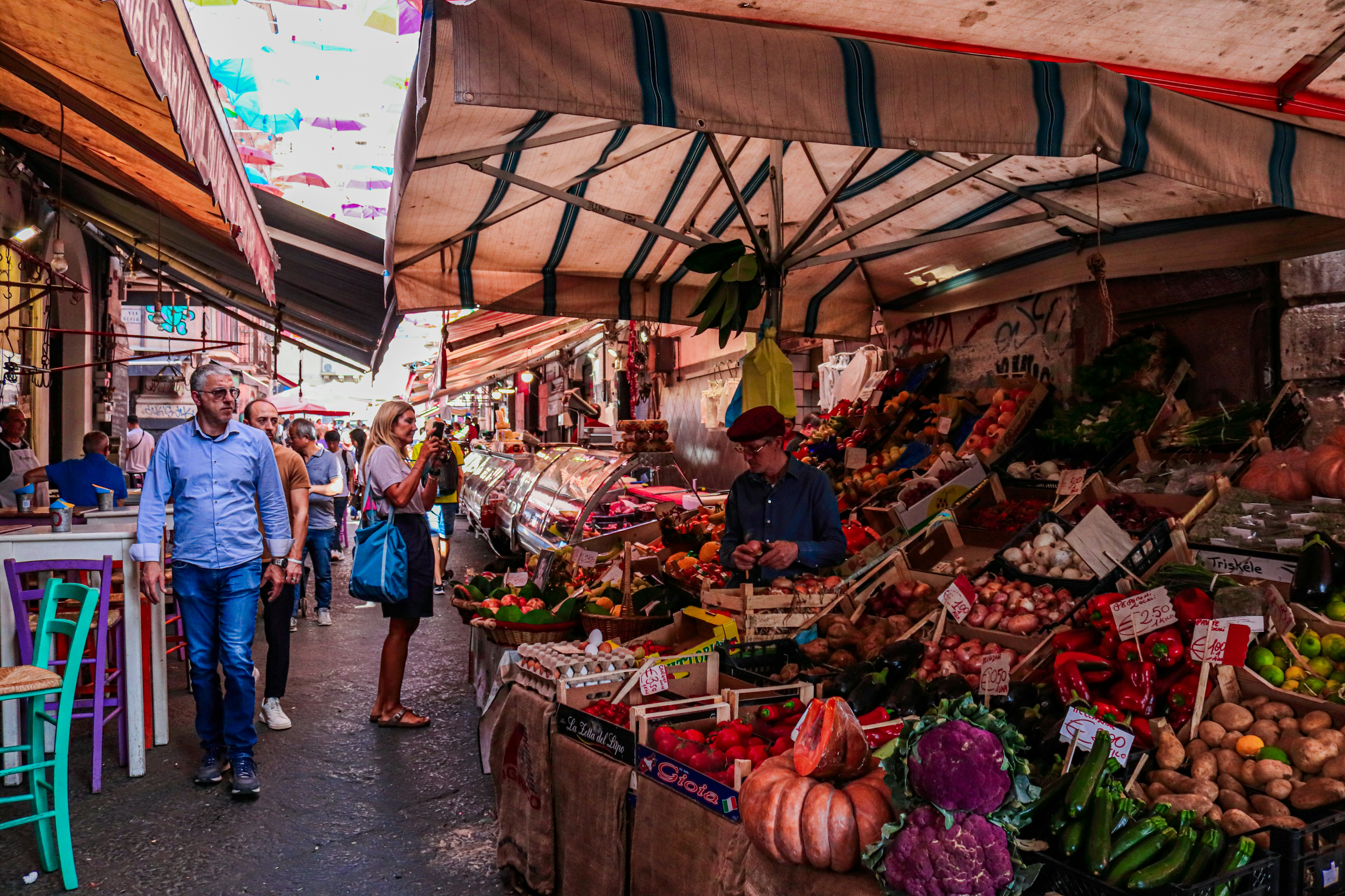 Colorful outdoor market with fresh produce and local vendors