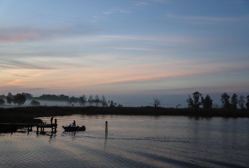 a person in a boat on a lake