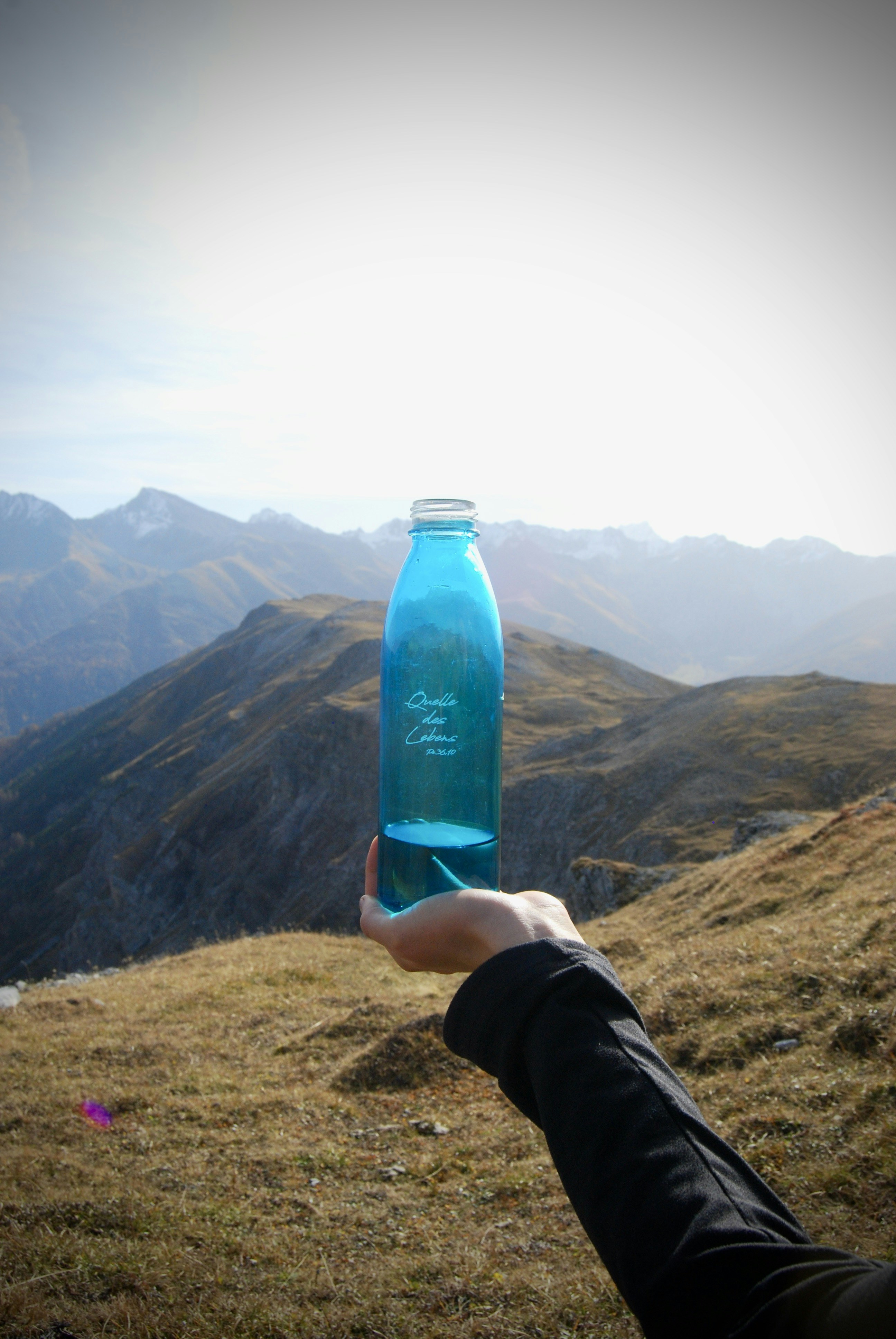 a person holding a bottle of water