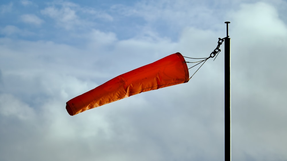 a red object on a pole