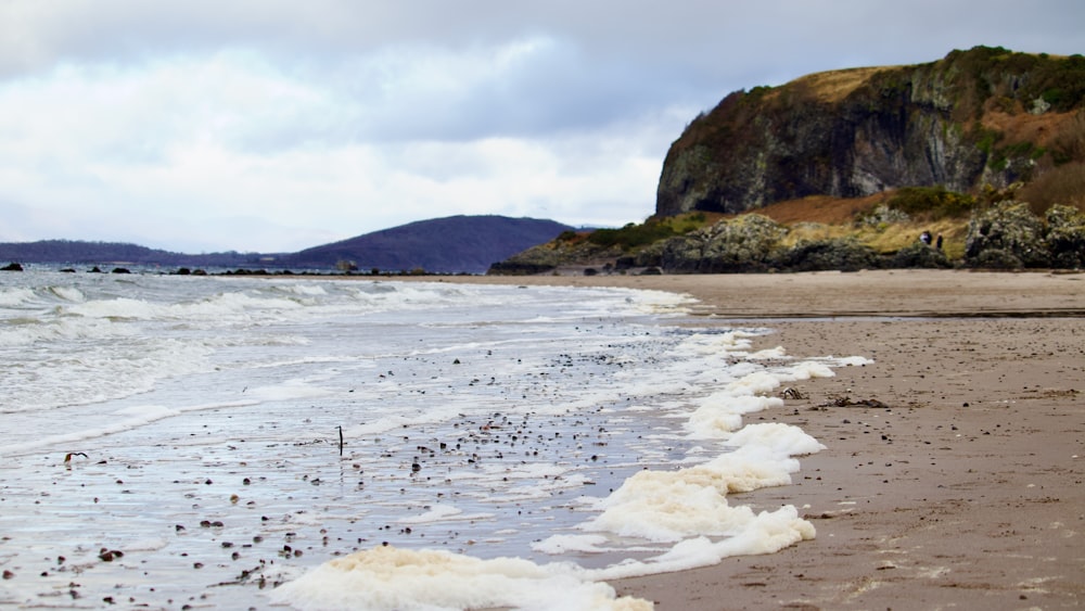 a beach with ice and snow