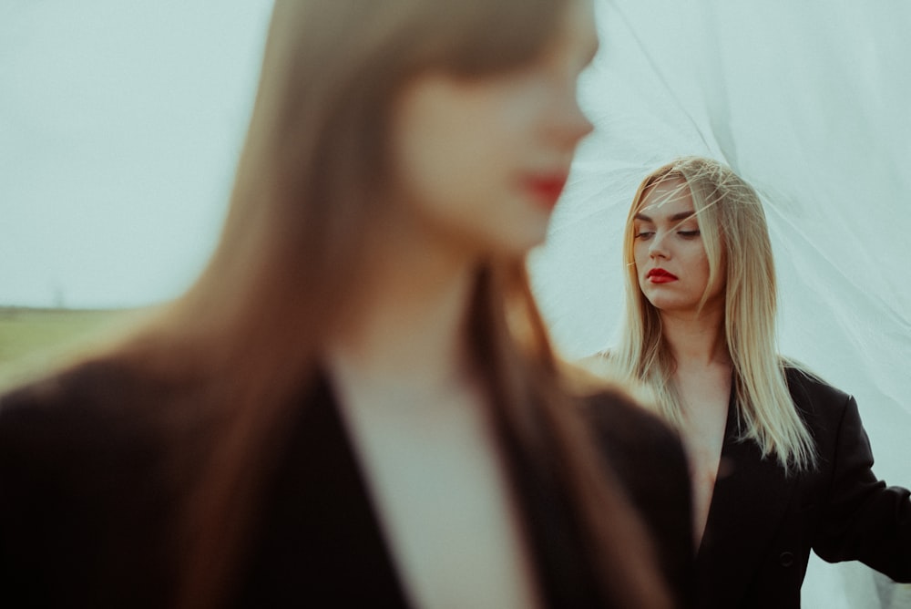 a woman looking at another woman