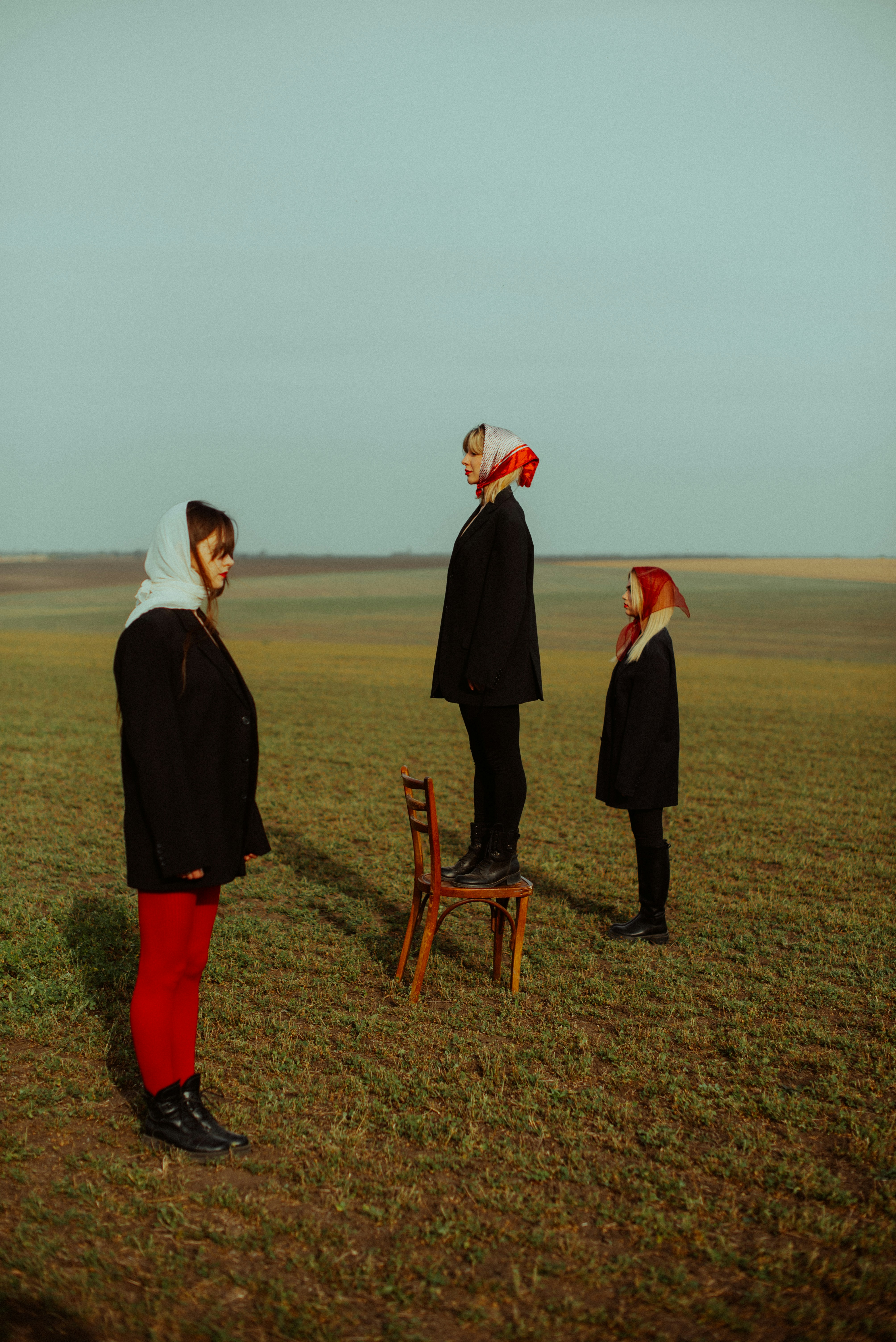a group of people standing on a field