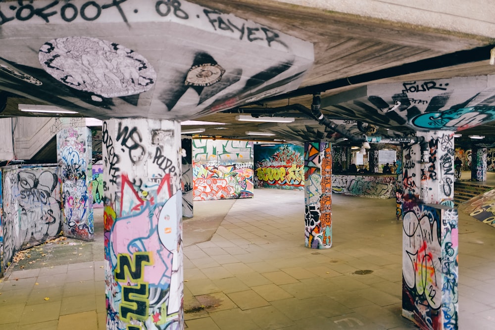 a hallway with graffiti on the walls