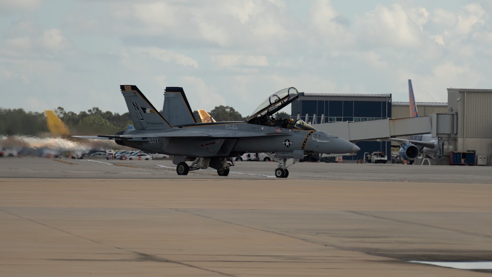 a fighter jet on the runway