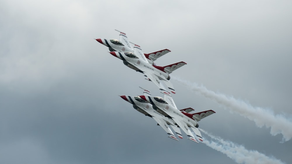 a group of jets fly through the air