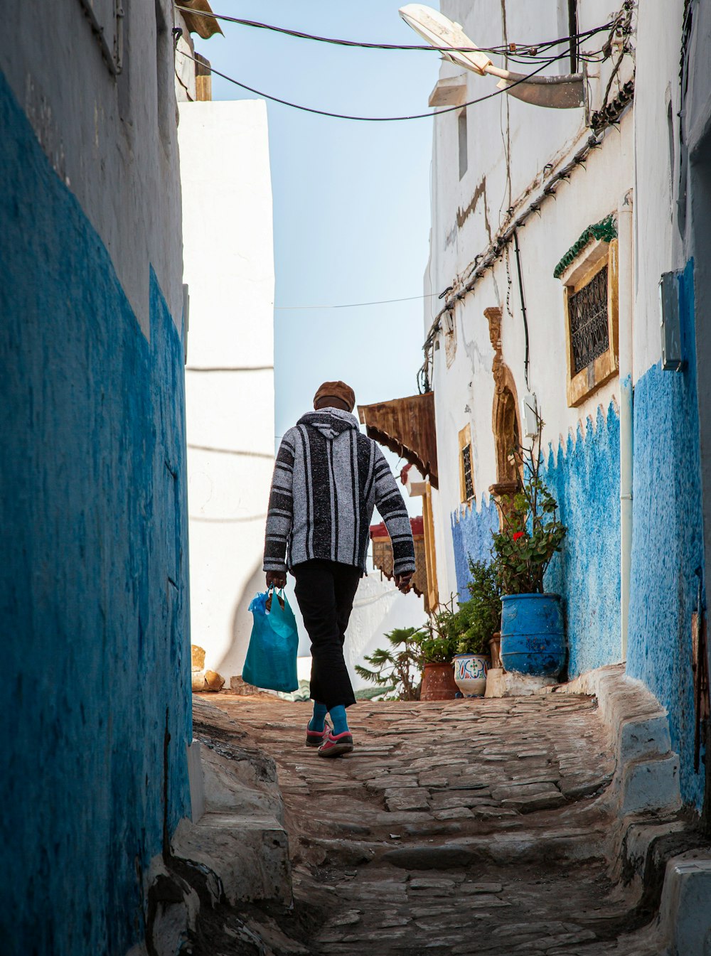 a person walking up a stone staircase