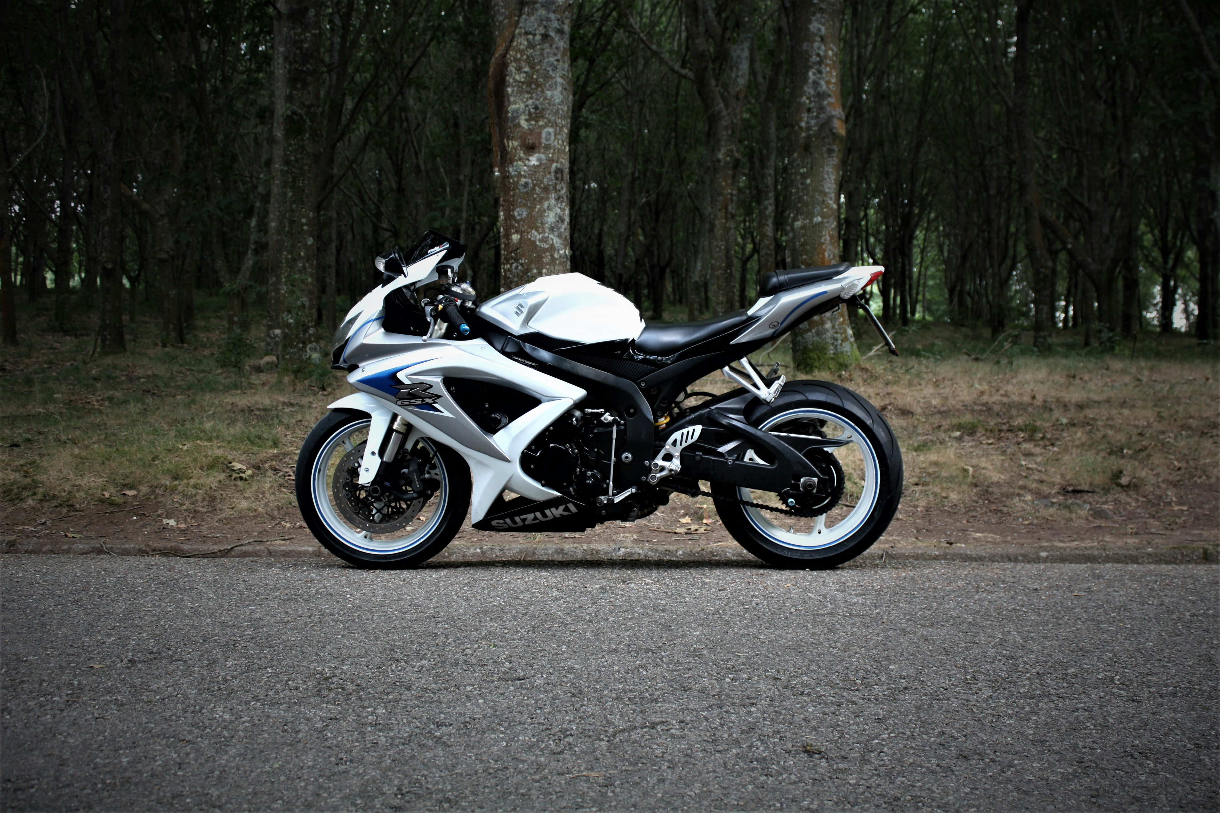 a motorcycle parked on the side of a road