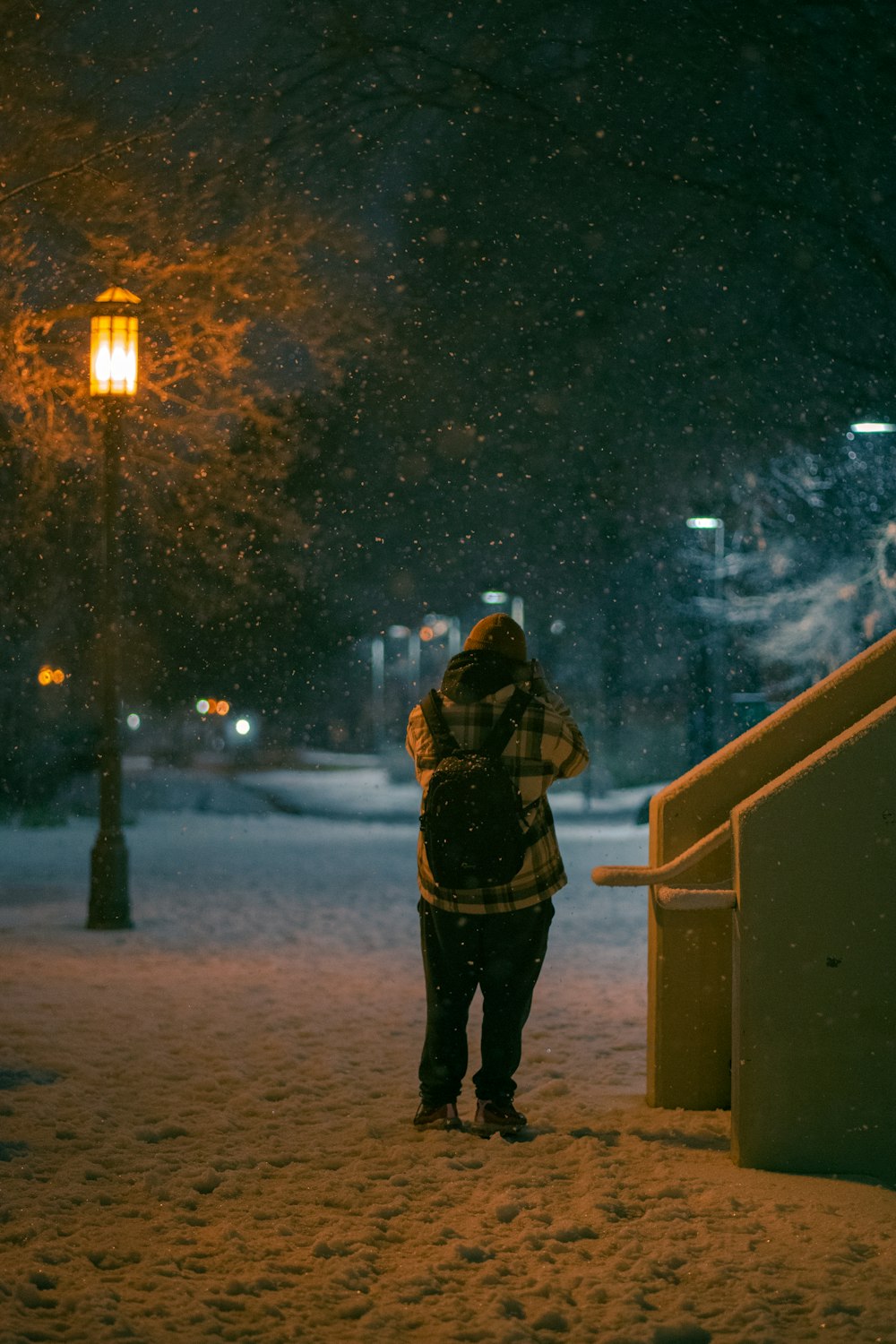 a person standing on a snowy road